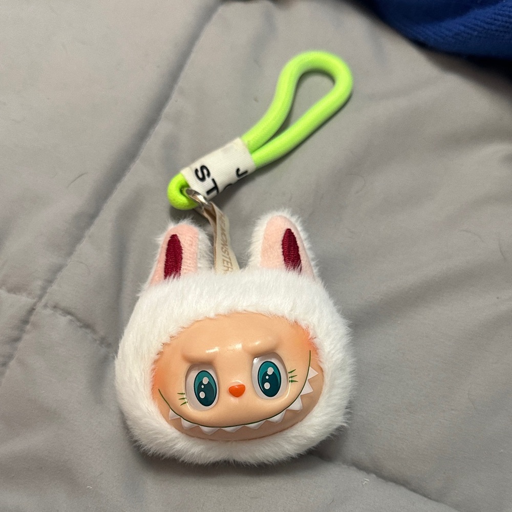 Fluffy White Labubu Keychain, sings and lights up.